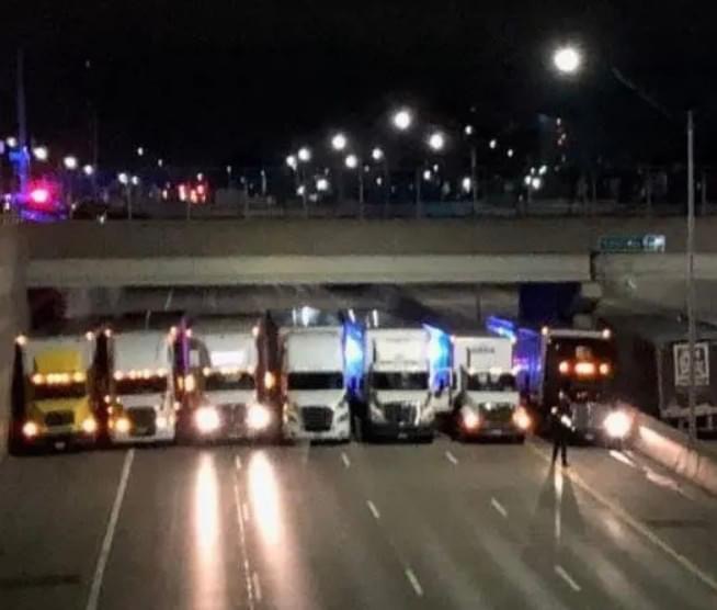 13 Truck Drivers Turn Heads After Blocking Highway To Form ‘Safety Net’